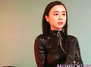 Costumed asian mom anent catsuit facialized
